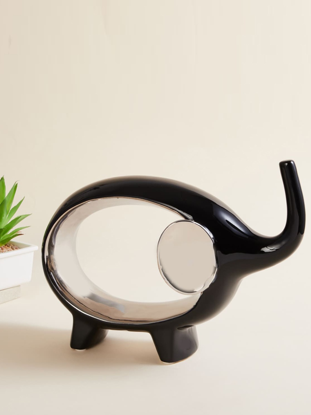 

Home Centre Black Solid Elephant Figurine Ceramic Showpiece