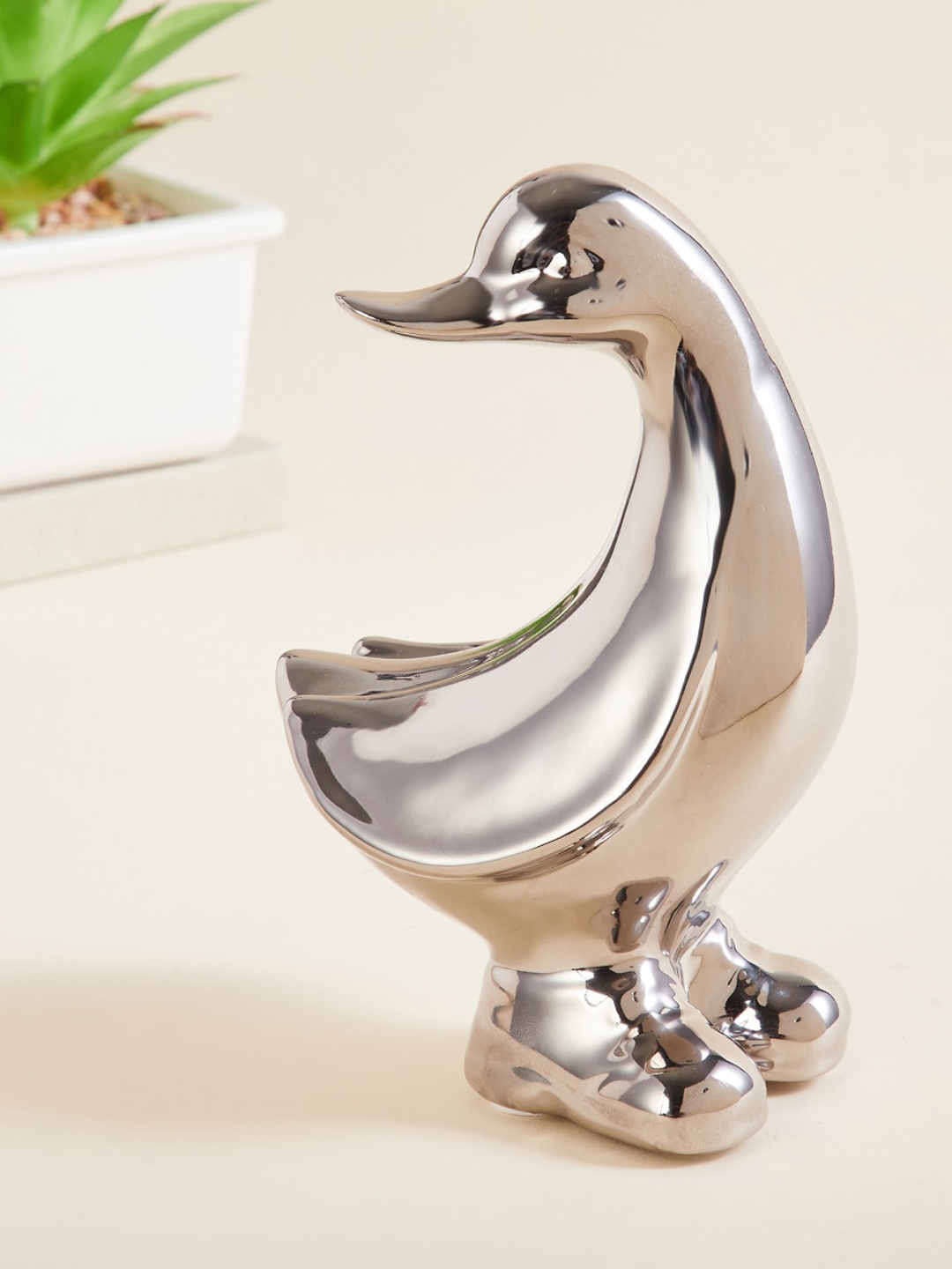 

Home Centre Silver-Toned Solid Ceramic Duck Figurine Showpieces