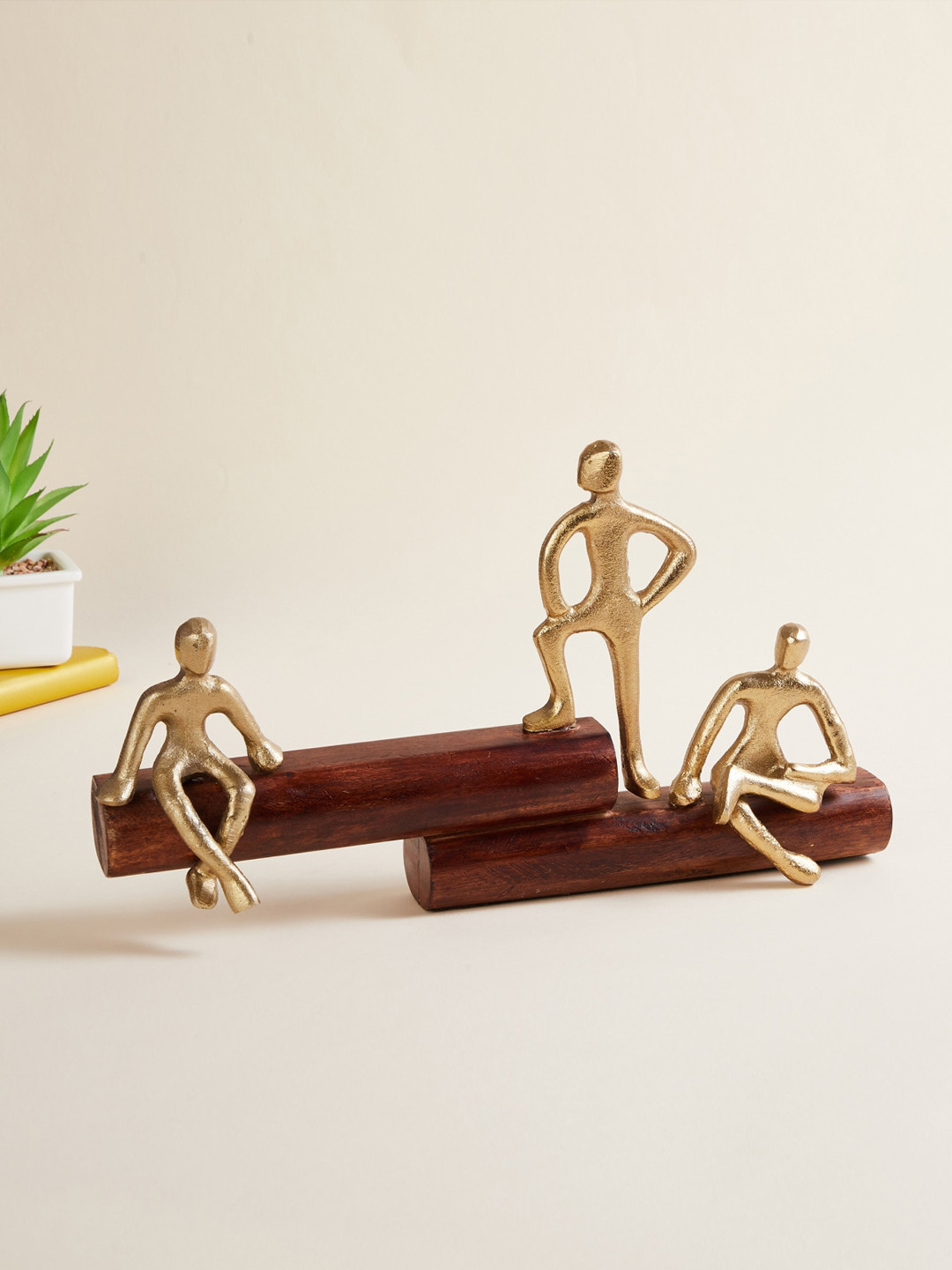 

Home Centre Gold-Toned & Brown Solid Polyresin Three People Figurine