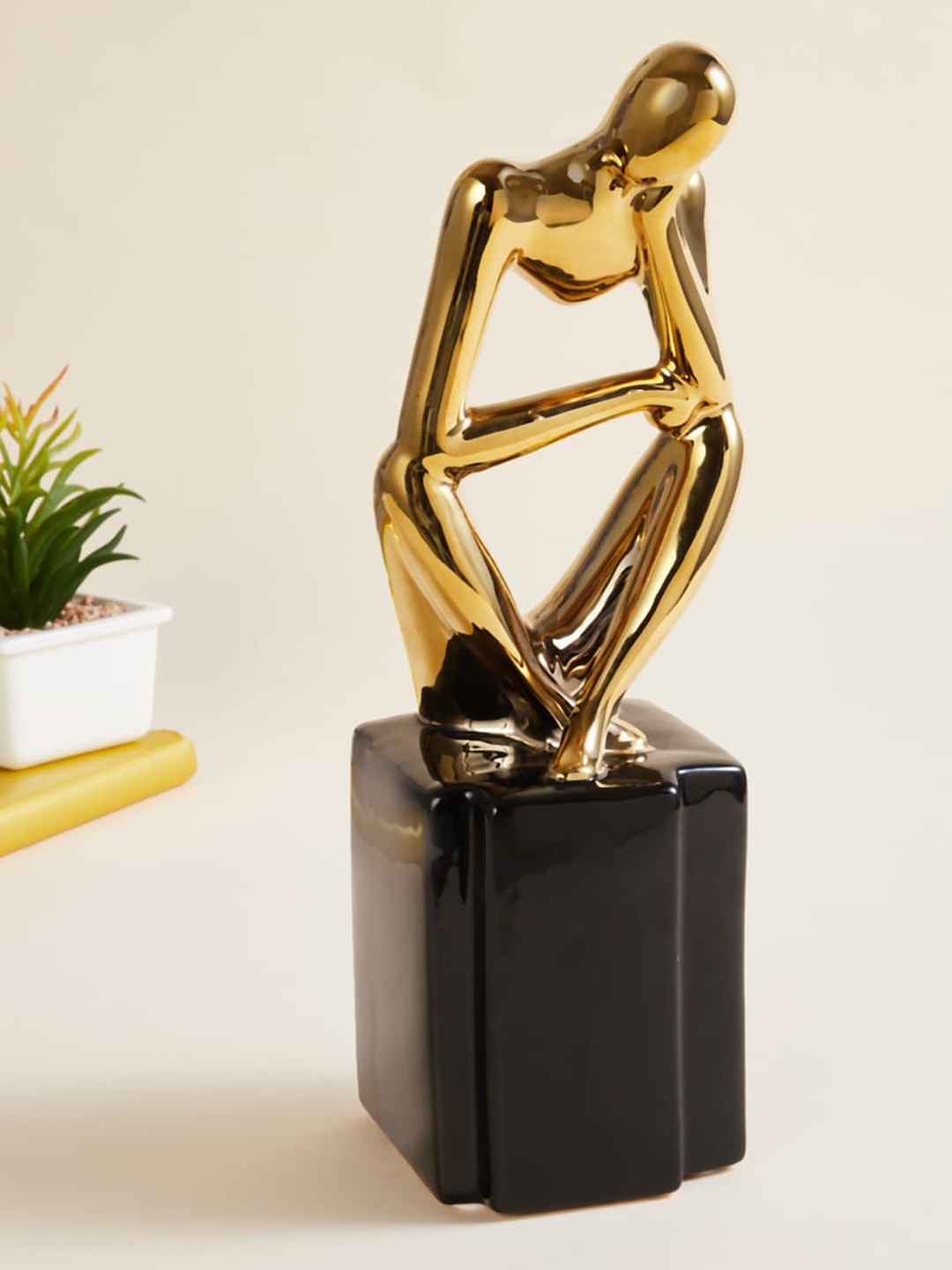 

Home Centre Gold Solid Ceramic Sitting Figurine