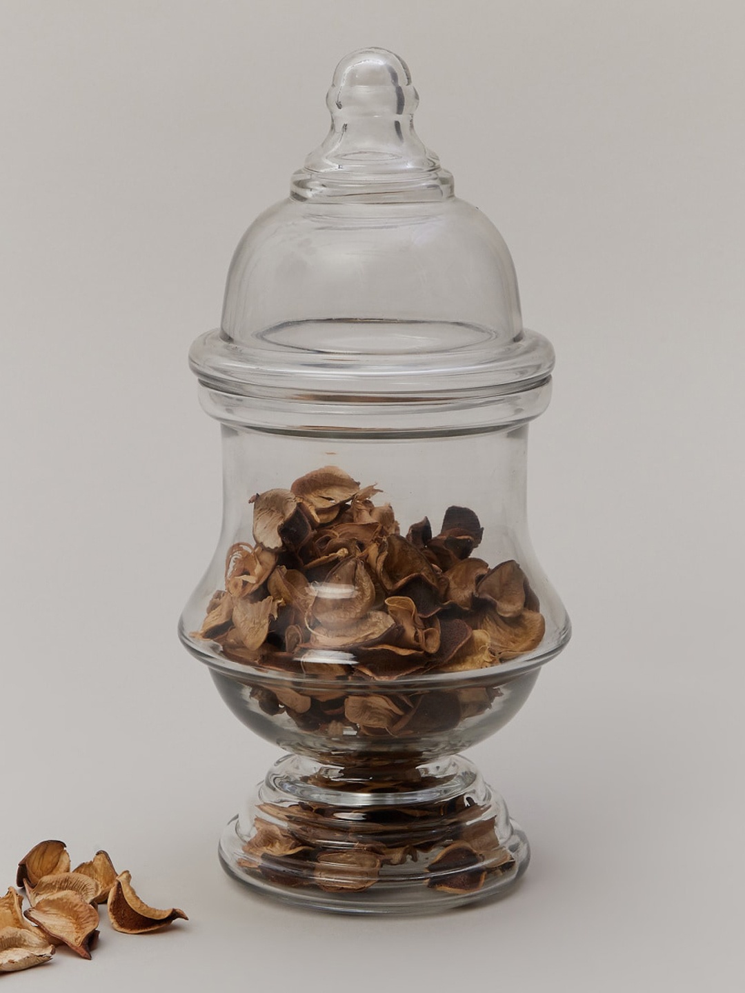 

Home Centre Transparent Solid Glass Decor Jar With Lid Showpiece