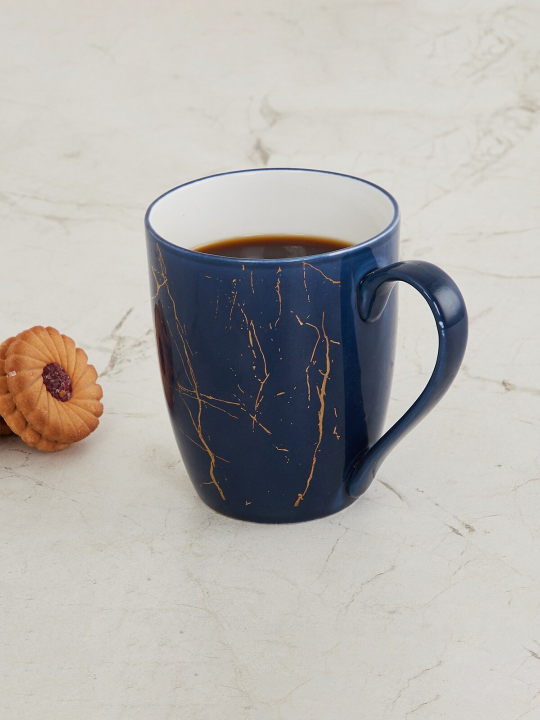

Home Centre Blue & Gold-Toned Printed Bone China Glossy Coffee Mug 340ml