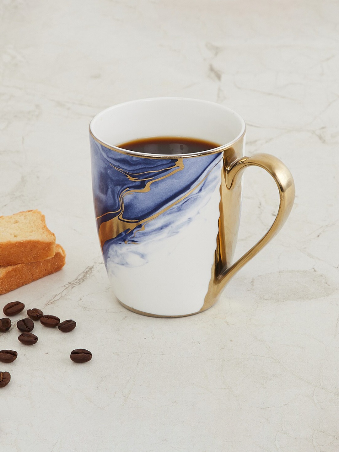 

Home Centre Blue & White Printed Bone China Glossy Mug 340ml
