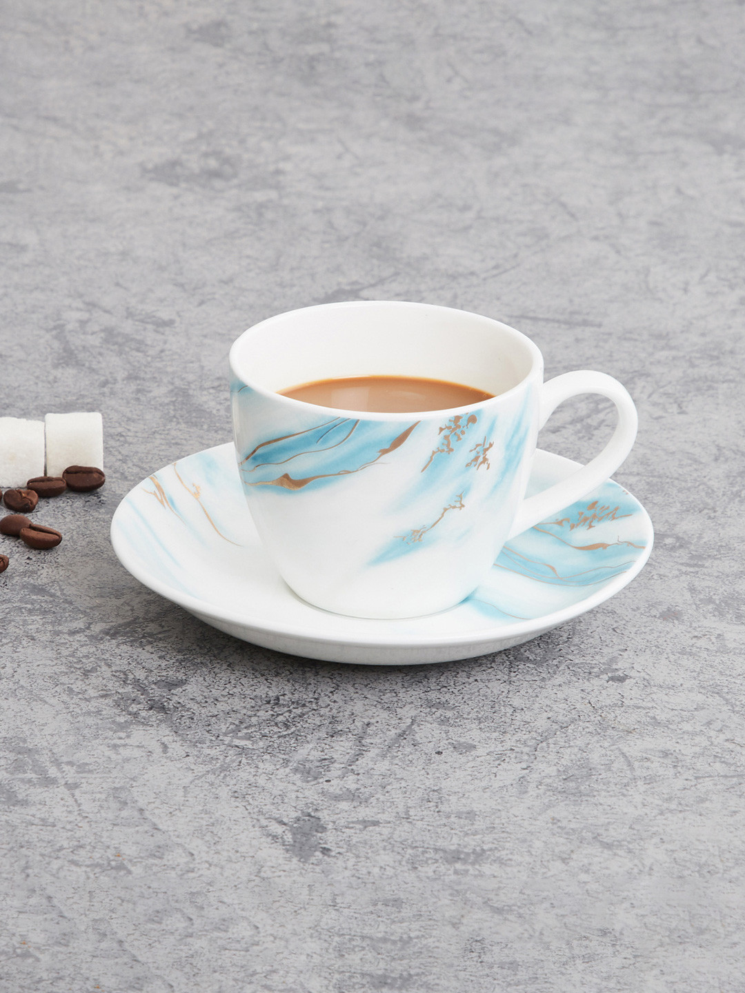 

Home Centre Teal & White Printed Bone China Glossy Cups and Saucers Set of Cups and Mugs