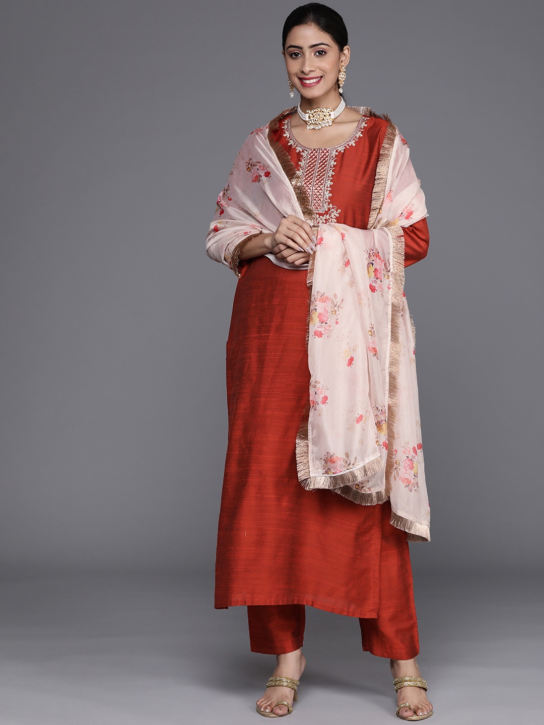 

Varanga Women Rust Ethnic Motifs Embroidered Dupion Silk Kurta with Trousers & With Dupatta