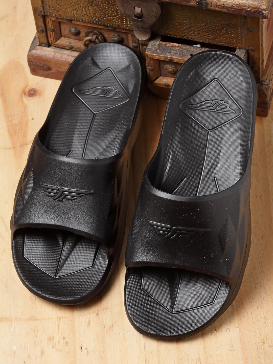 

Red Tape Men Black Solid Sunnies Sliders