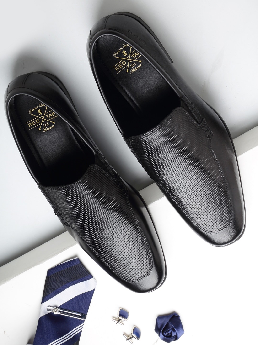 

Red Tape Men Black Solid Leather Formal Slip-On Shoes
