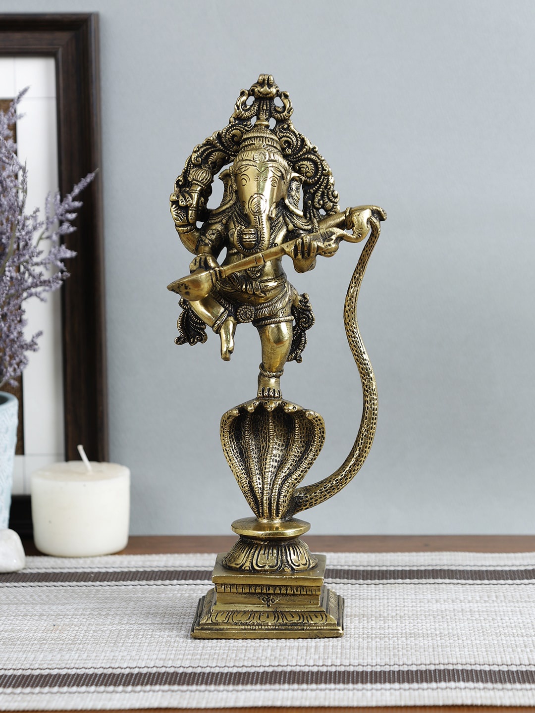

Imli Street Gold-Toned Ganesh On Snake Showpiece