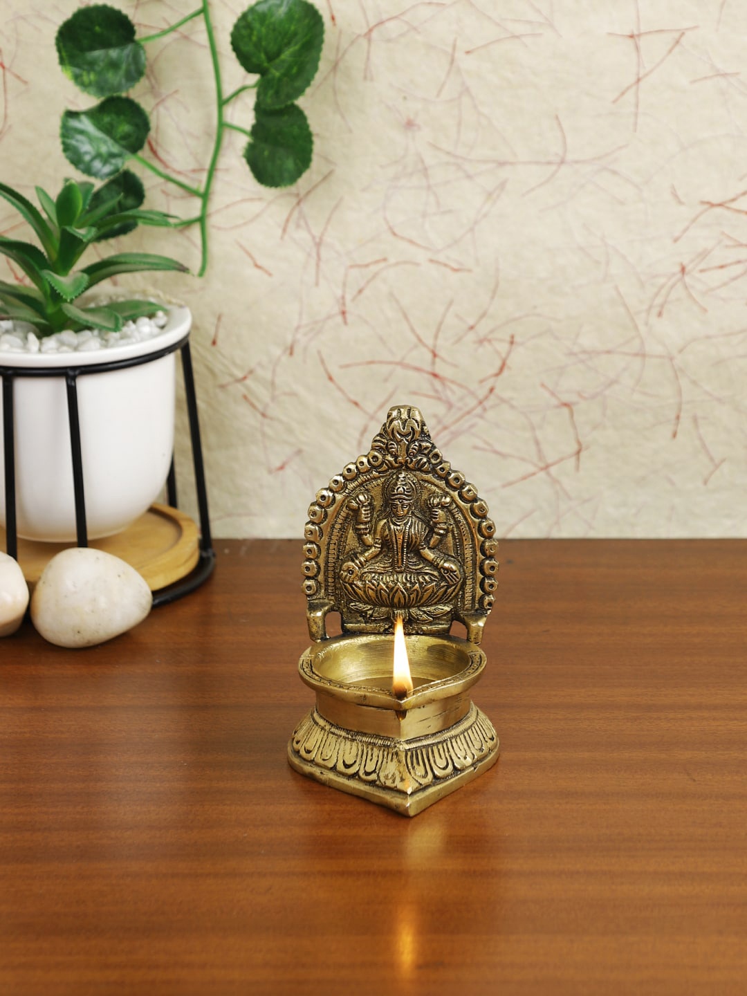 

Imli Street Gold-Toned Laxmi Diya Showpiece