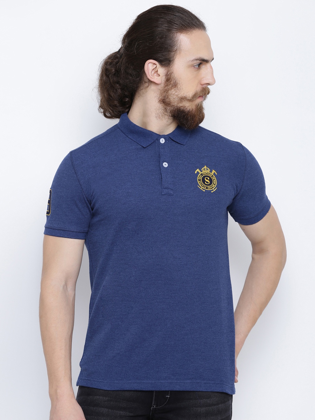 

Status Quo Men Blue Solid Polo Collar T-shirt