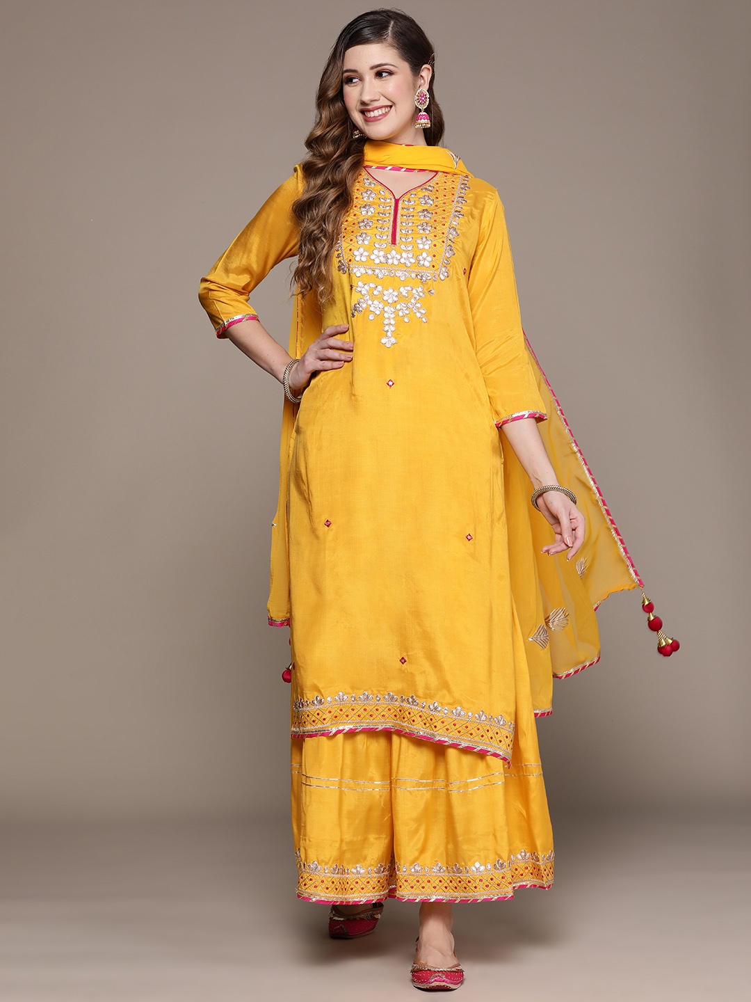 

Ishin Women Yellow Ethnic Motifs Embroidered Gotta Patti Kurta with Sharara & Dupatta