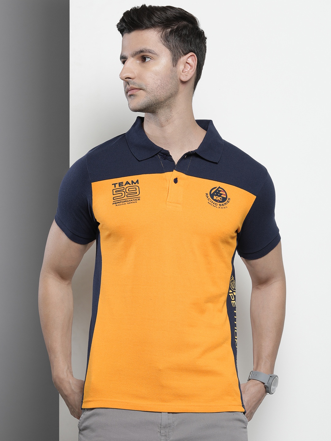 

The Indian Garage Co Men Yellow & Navy Blue Colourblocked Polo Collar T-shirt