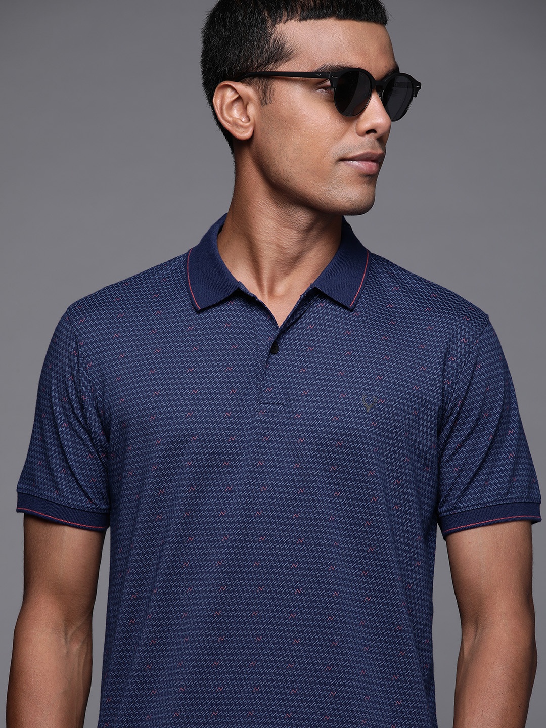 

Allen Solly Men Navy Blue & Orange Geometric Printed Polo Collar T-shirt