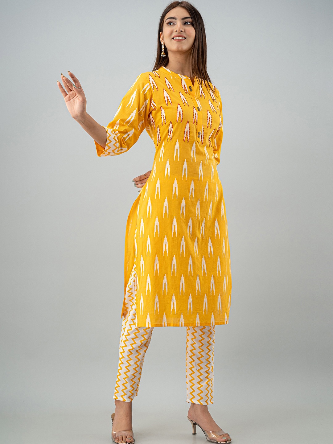 

OMASK Women Yellow & White Ikat Printed Pleated Pure Cotton Kurta with Trousers