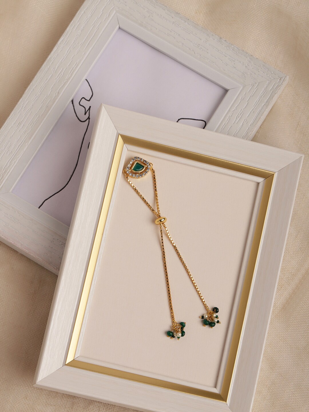 

Ruby Raang Women Gold-Plated & Green Brass Charm Bracelet