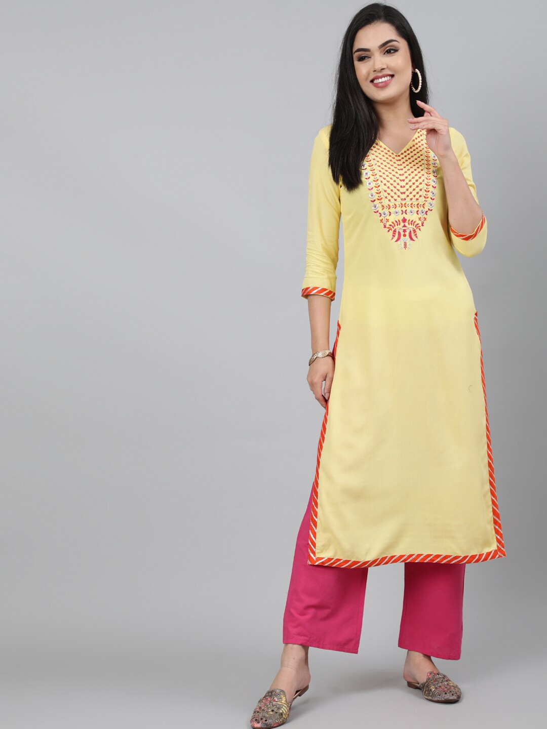 

KIMAYRA Women Yellow Floral Embroidered Kurta with Palazzos