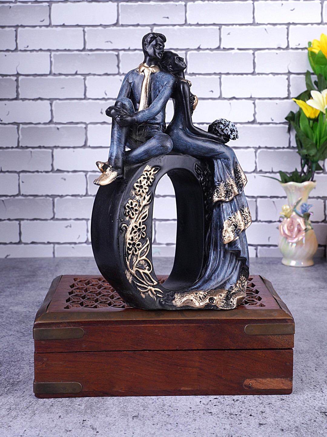 

FASHIYANOO Black and Bronze-toned Couple Alphabet Showpiece