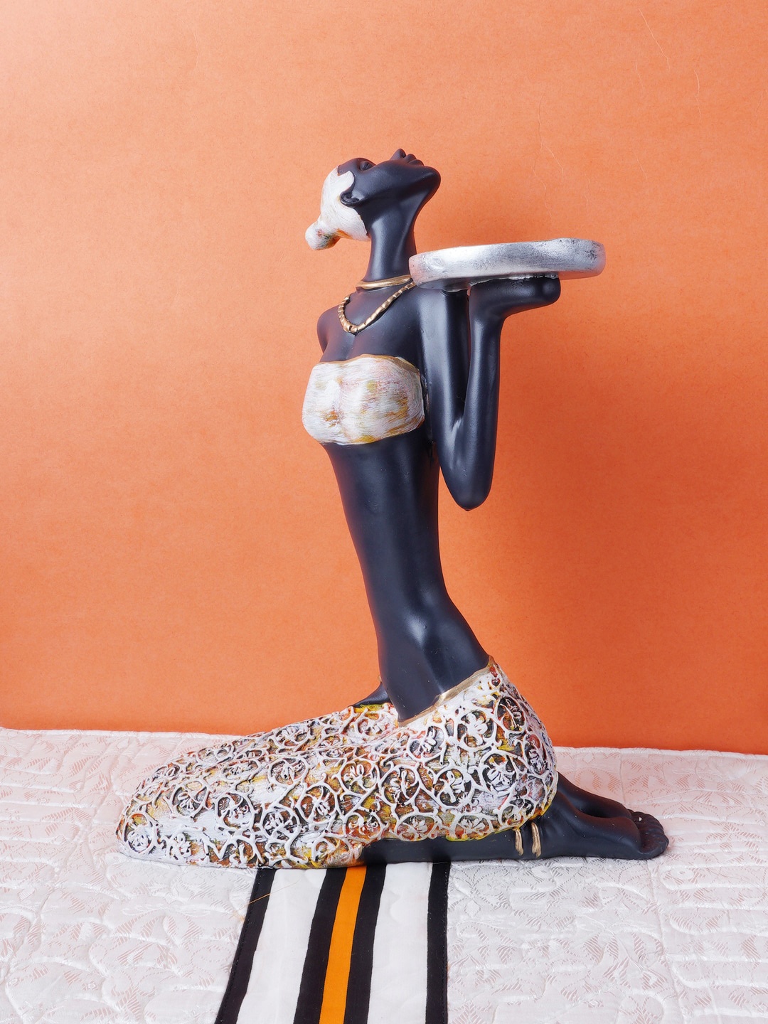 

FASHIYANOO Black Sitting Doll With Silver Plate In Hand Showpiece