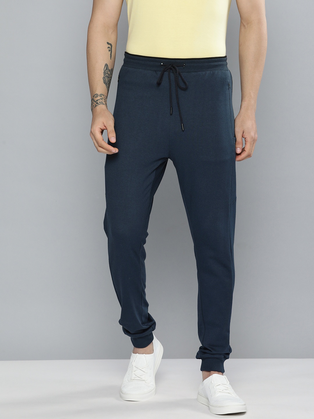 

Mast & Harbour Men Navy Blue Solid Mid Rise Casual Joggers