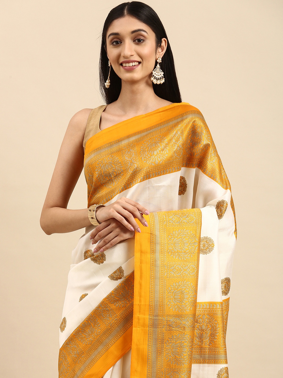 

Anouk White & Golden Ethnic Motifs Art Silk Banarasi Saree