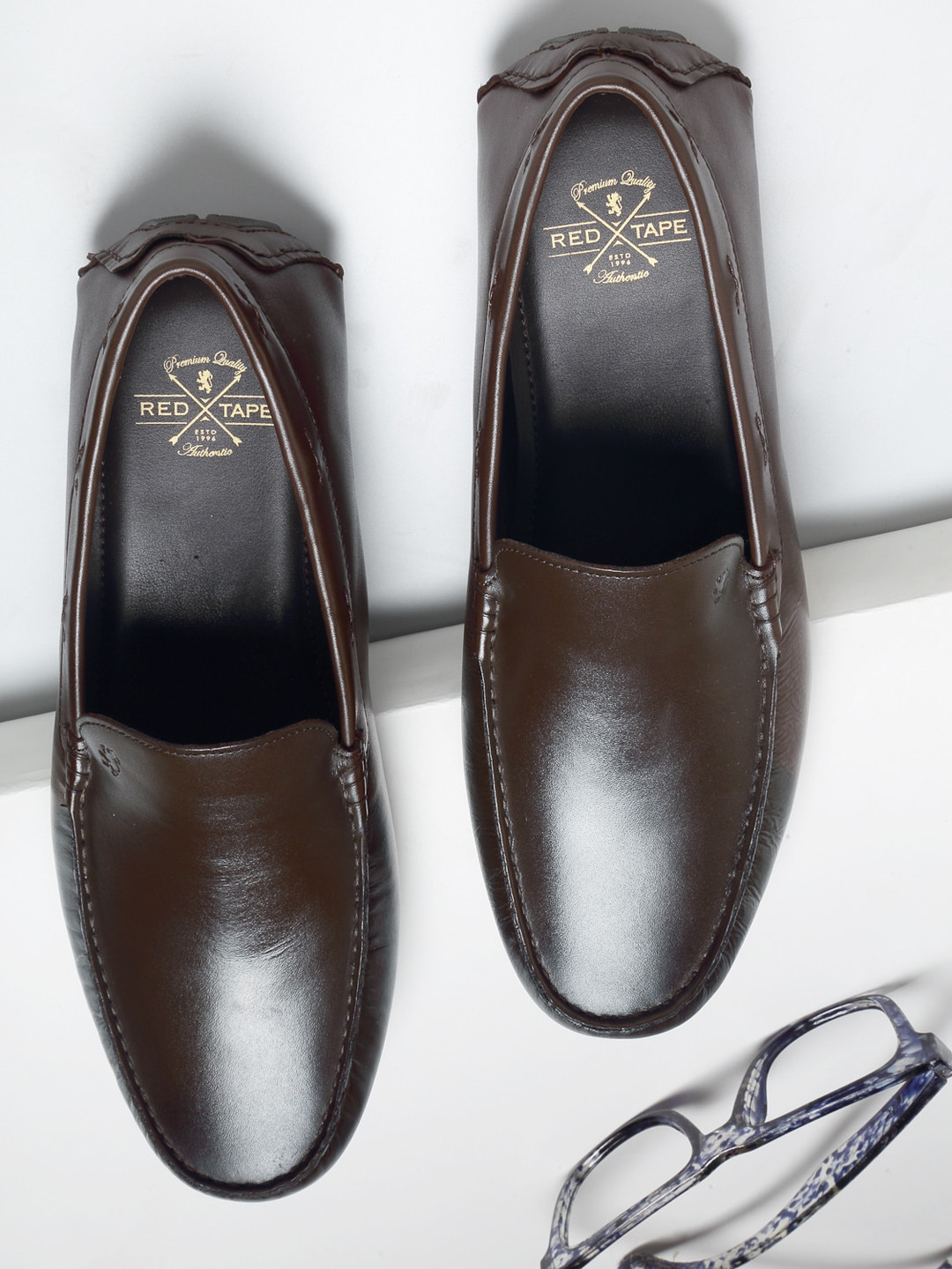 

Red Tape Men's Brown Solid Formal Loafers