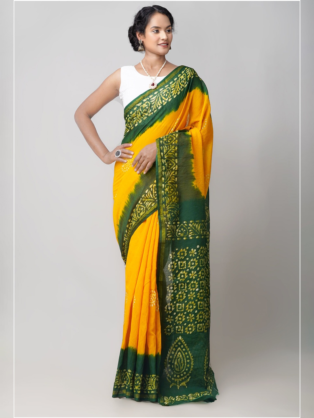 

Unnati Silks Yellow & Green Tie and Dye Handloom & Sustainable Pure Cotton Batik Chanderi Saree