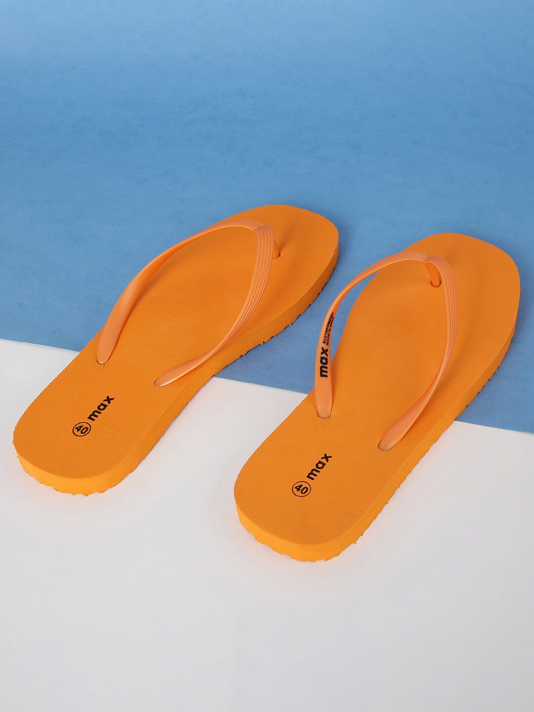 

max Women Orange Solid Thong Flip-Flops