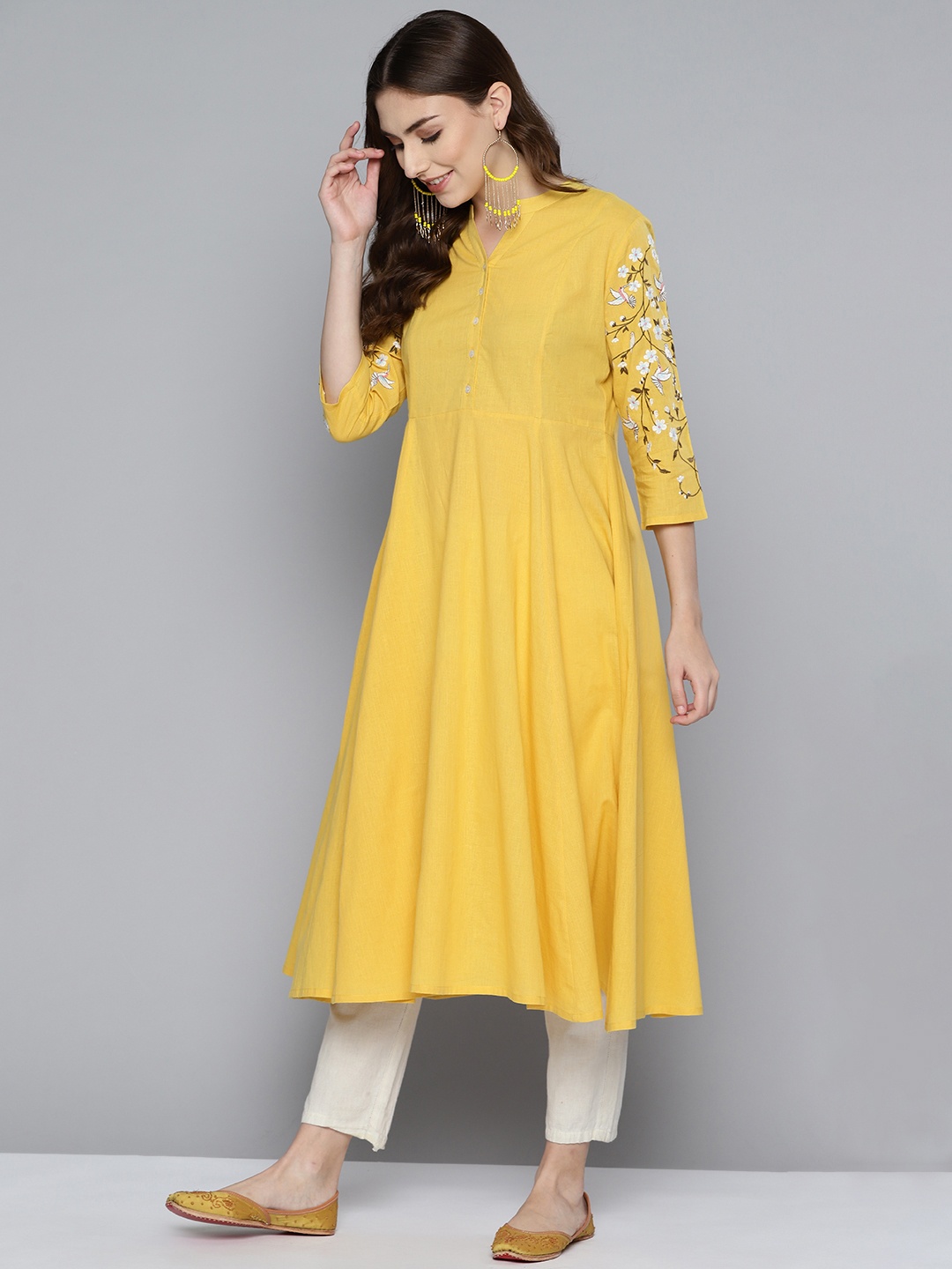 

HERE&NOW Women Yellow Solid Floral Embroidery A-line Kurta
