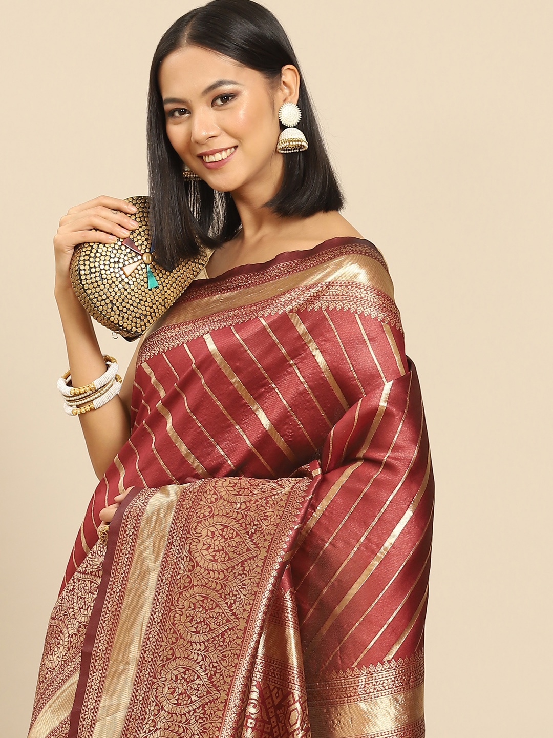 

Anouk Maroon & Golden Striped Banarasi Saree