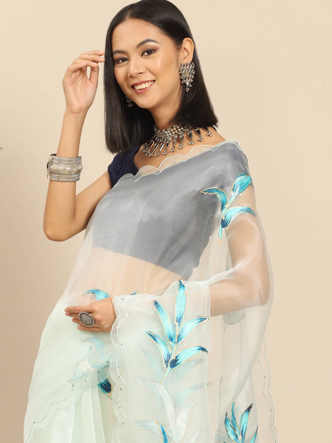 

Anouk Off White & Sea Green Hand-Printed Floral Organza Saree