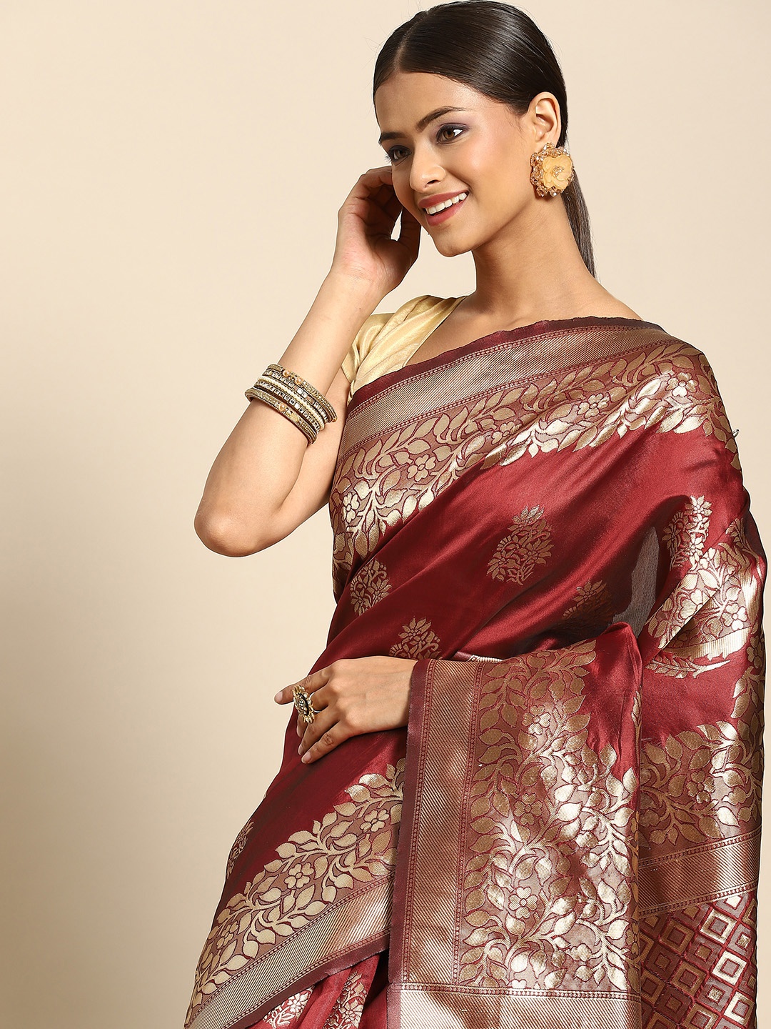

Anouk Maroon & Golden Ethnic Motifs Silk Blend Banarasi Saree