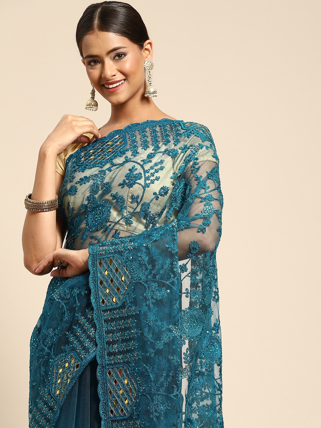 

Anouk Teal Blue Ethnic Motifs Beads and Stones Net Saree