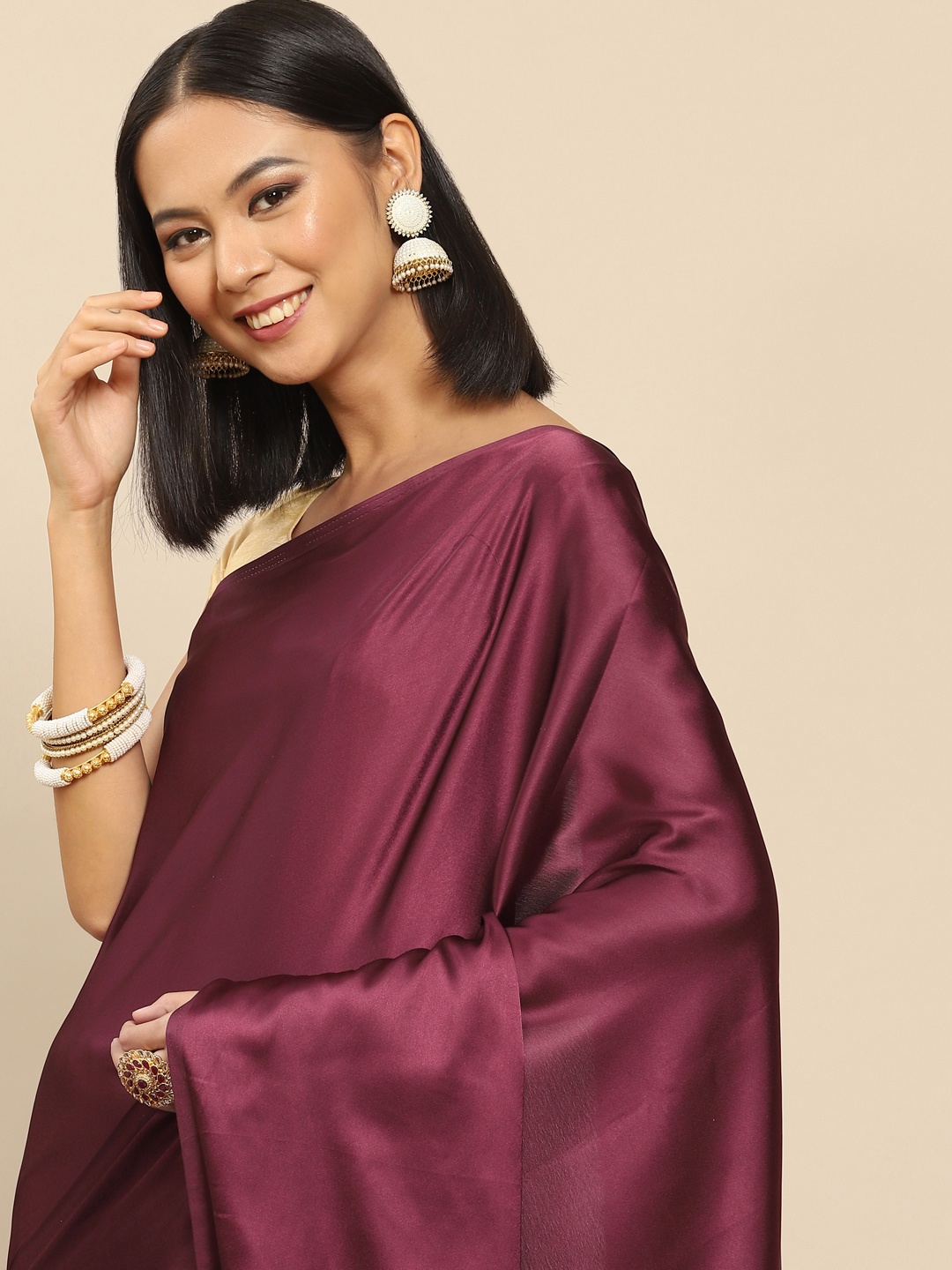 

Anouk Burgundy Solid Satin Saree