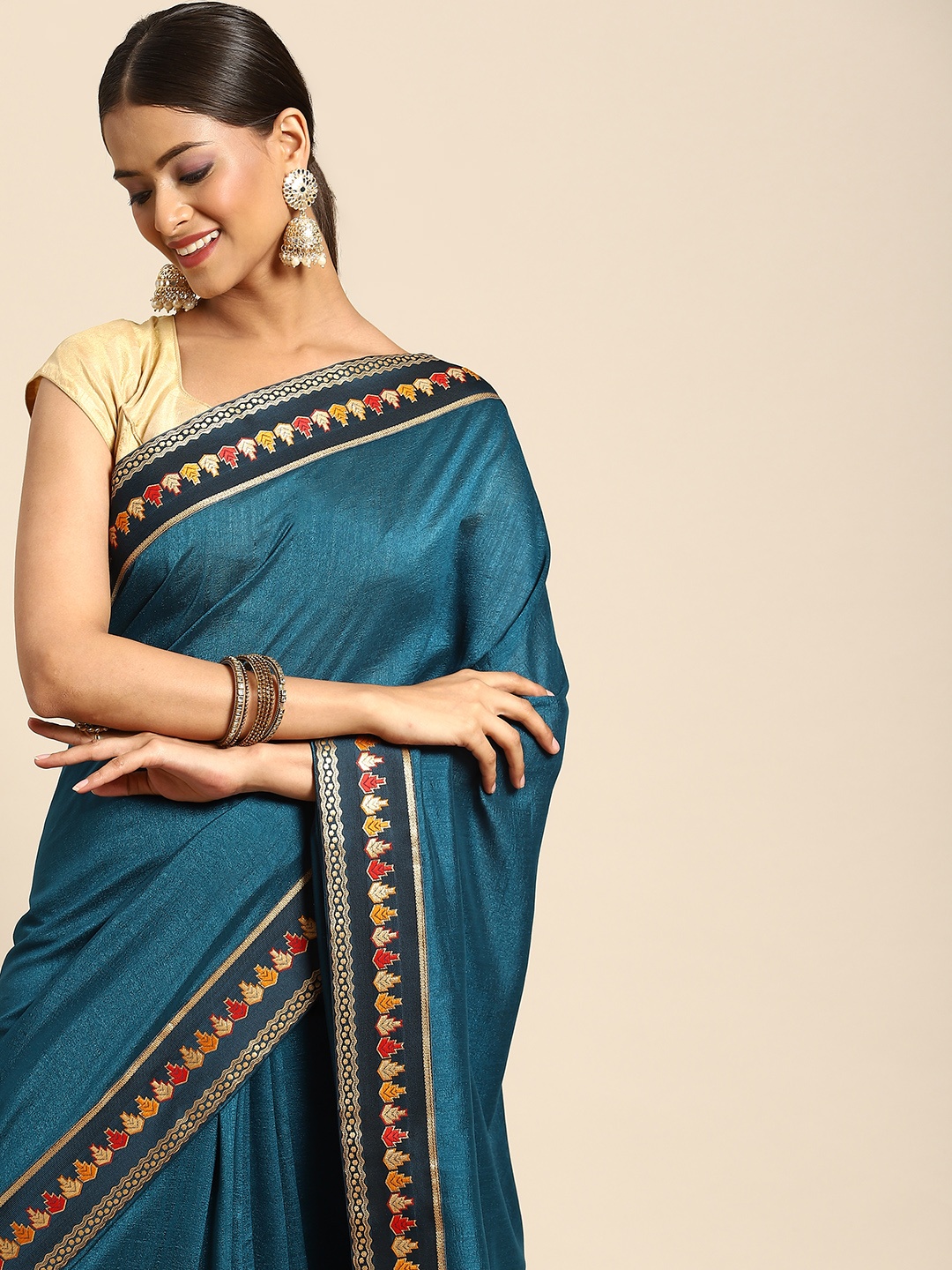 

Anouk Teal Blue Solid Saree