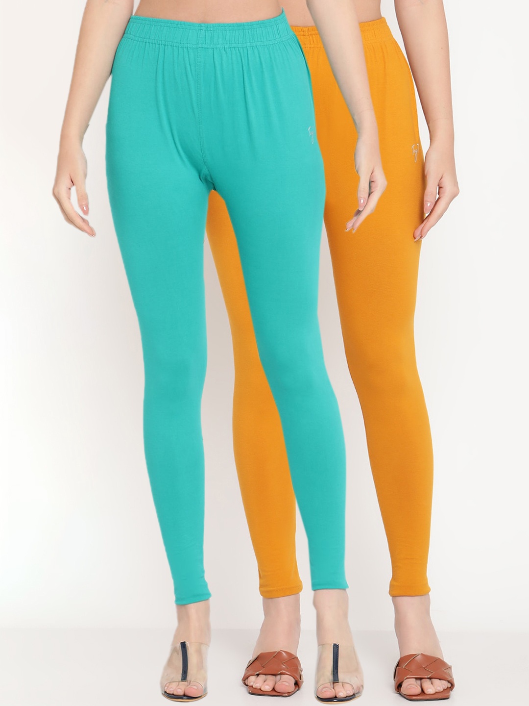 

TAG 7 Women Mustard & Sea Green Solid Ankle-Length Leggings Pack Of 2