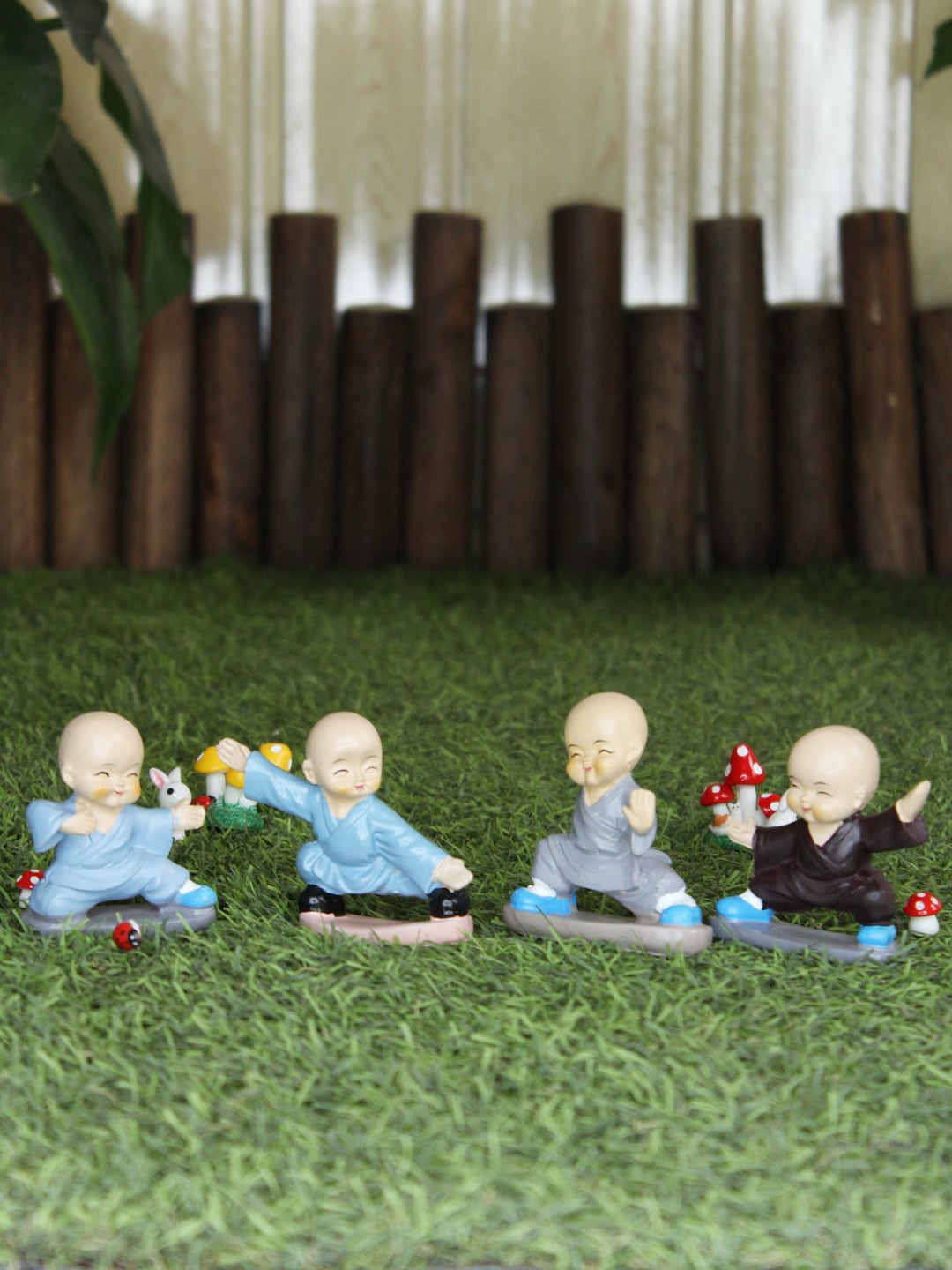 

Wonderland Set Of 4 Blue & Beige Kung Fu Monks Garden Accessories