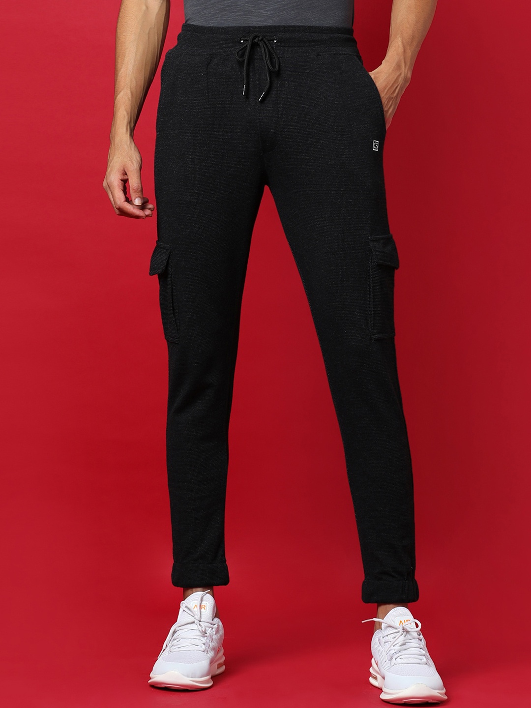 

Campus Sutra Men Black Solid Cotton Track Pants
