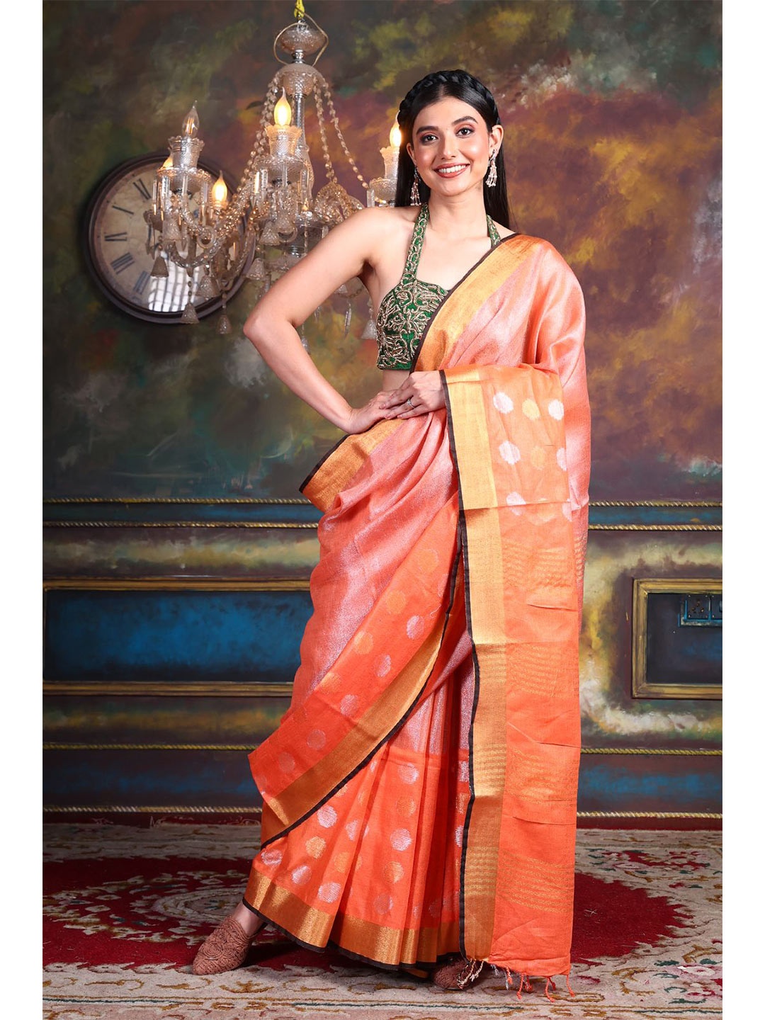 

Charukriti Orange & Golden Zari Tissue Saree
