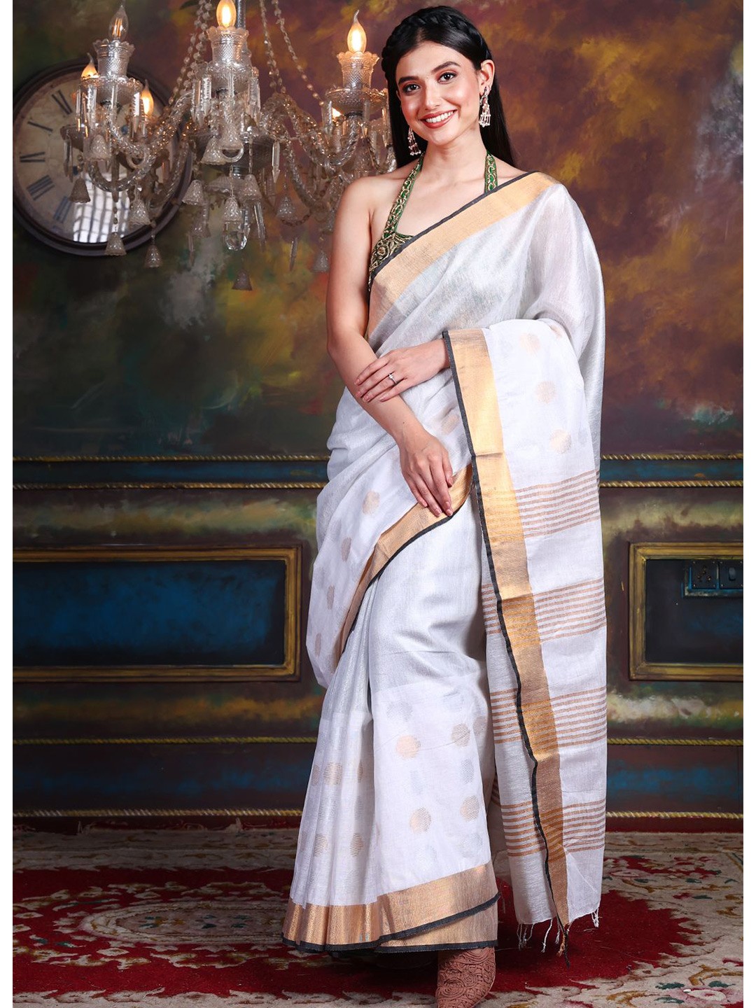 

Charukriti White & Golden Zari Tissue Saree