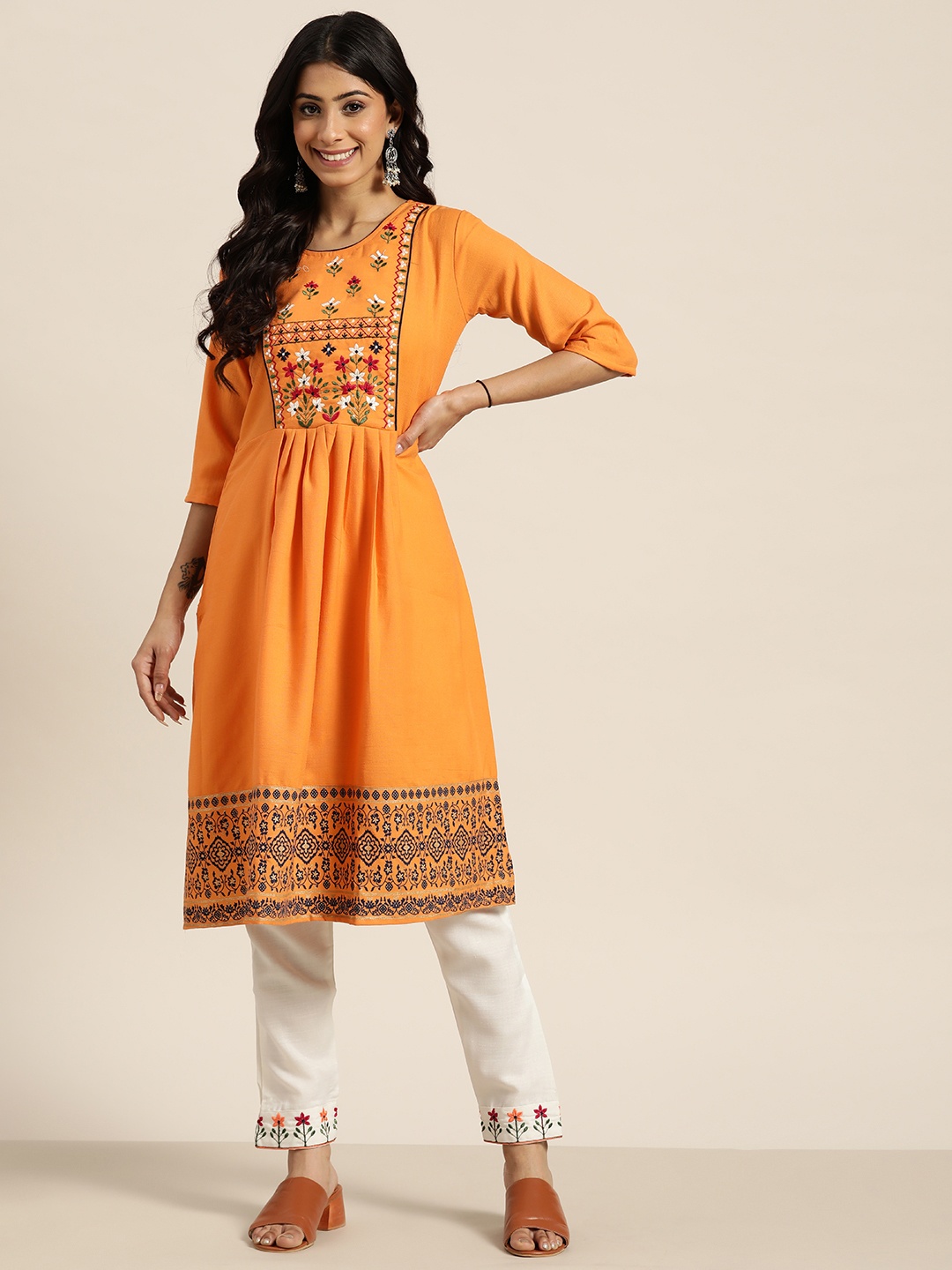 

Sangria Women Orange Ethnic Motifs Yoke Design Thread Work Kurta with Trousers