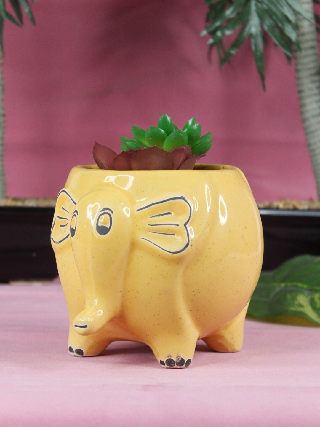 

Wonderland Yellow Solid Ceramic Flower pot Elephant Planter