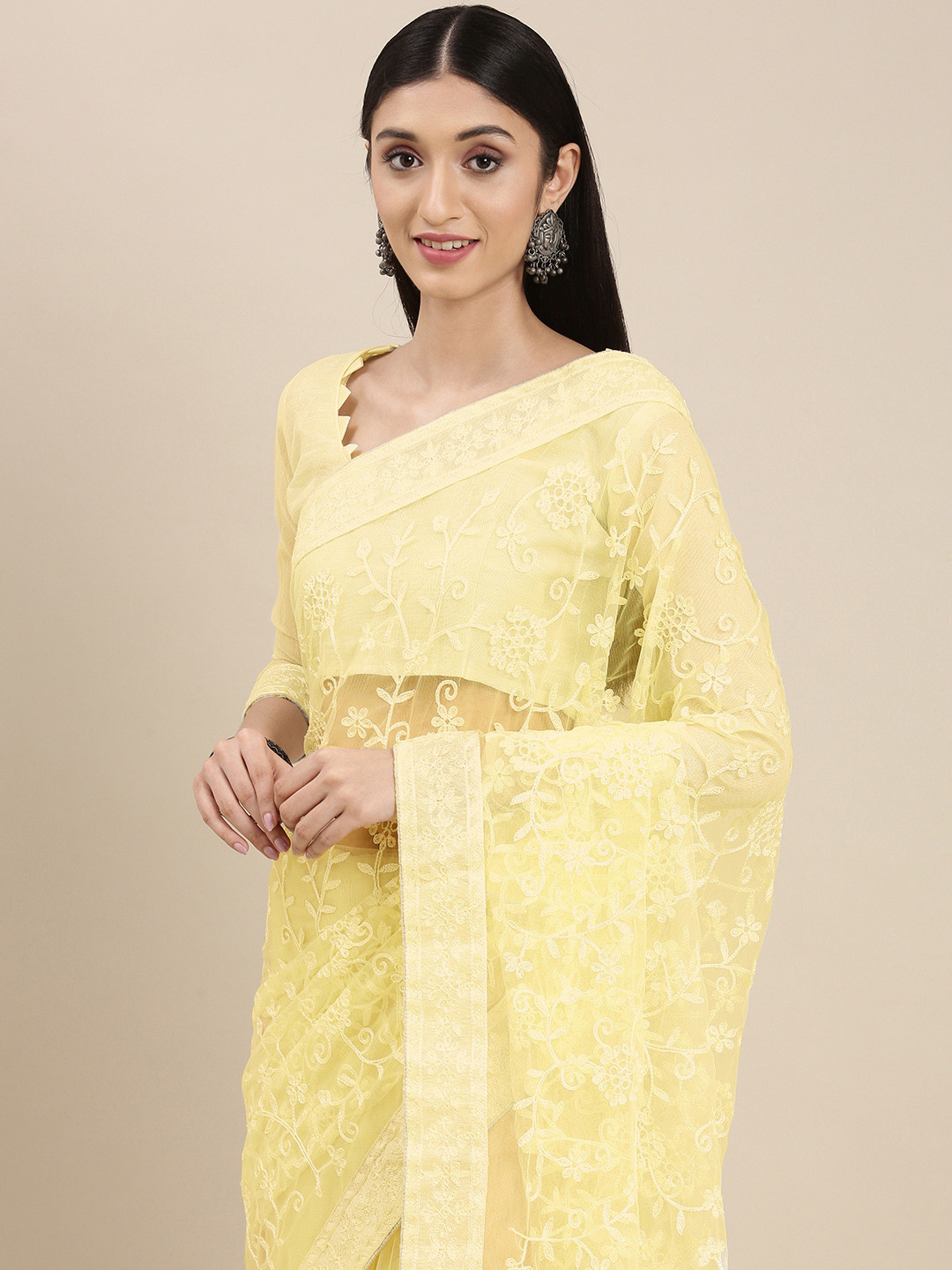 

VAIRAGEE Yellow Floral Embroidered Net Saree