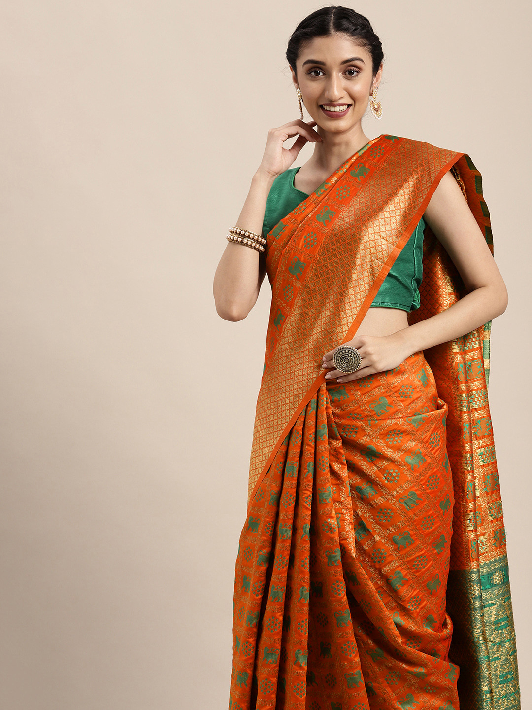 

Mitera Orange & Green Ethnic Motifs Zari Silk Blend Patola Saree
