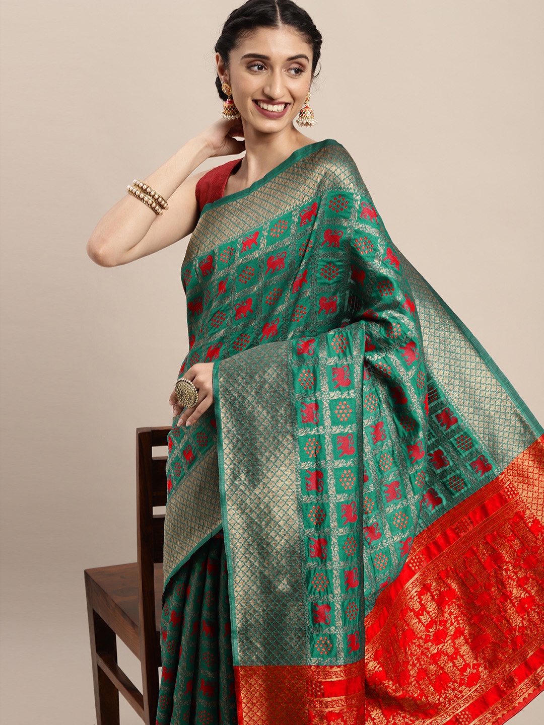

Mitera Teal Green & Red Woven Design Zari Silk Blend Patola Saree