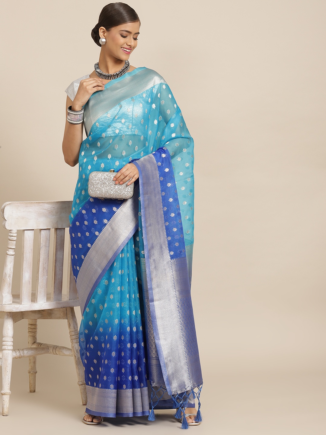 

Silk Land Blue & Silver Ethnic Motifs Woven Design Zari Kanjeevaram Saree