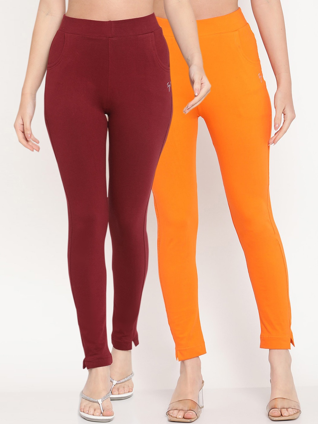 

TAG 7 Women Pack of 2 Orange & Maroon Solid Ankle Length Kurti Pants