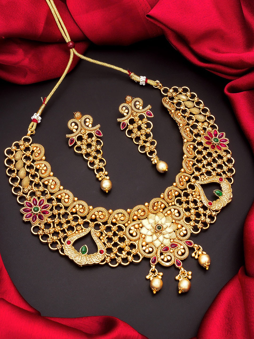 

Aadita Gold Plated & Red Stone Studded Temple Jewellery Set