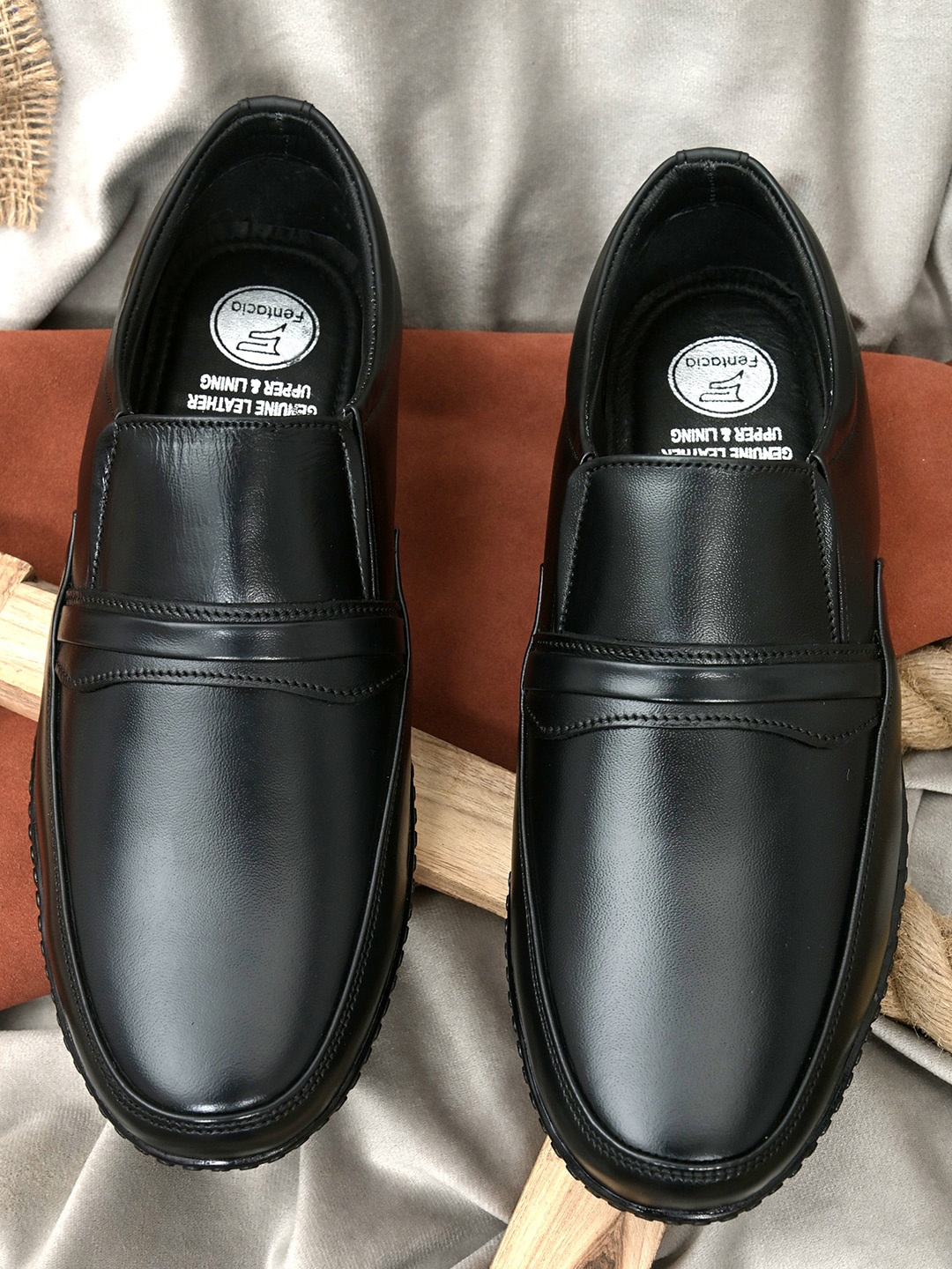 

Fentacia Men Black Solid Genuine Leather Formal Slip-Ons