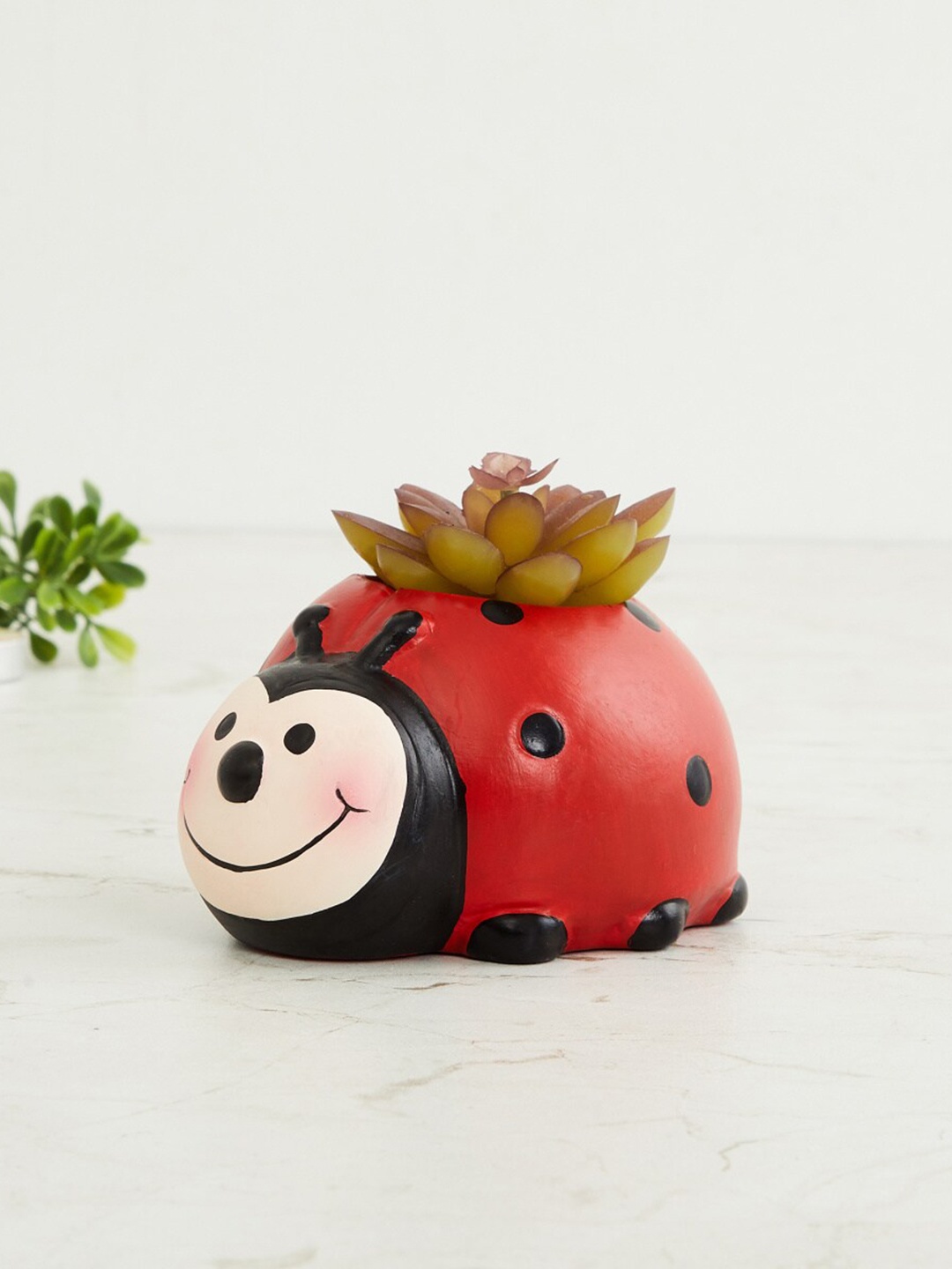 

Home Centre Red Colored Ladybug with Succulent Plant