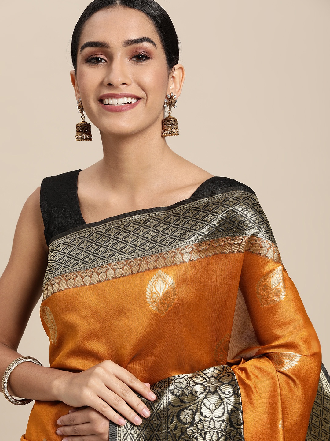 

Shaily Orange Woven Design Saree